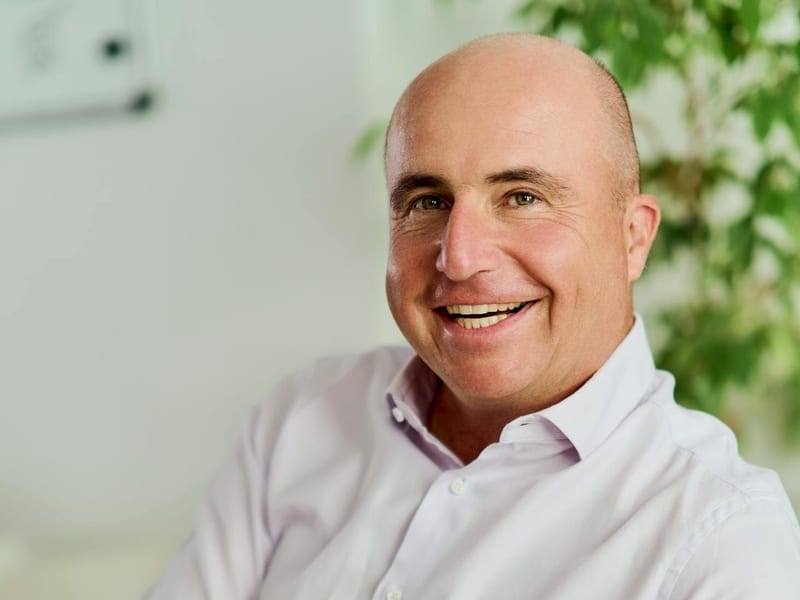 Tax advisor at a desk in a bright office